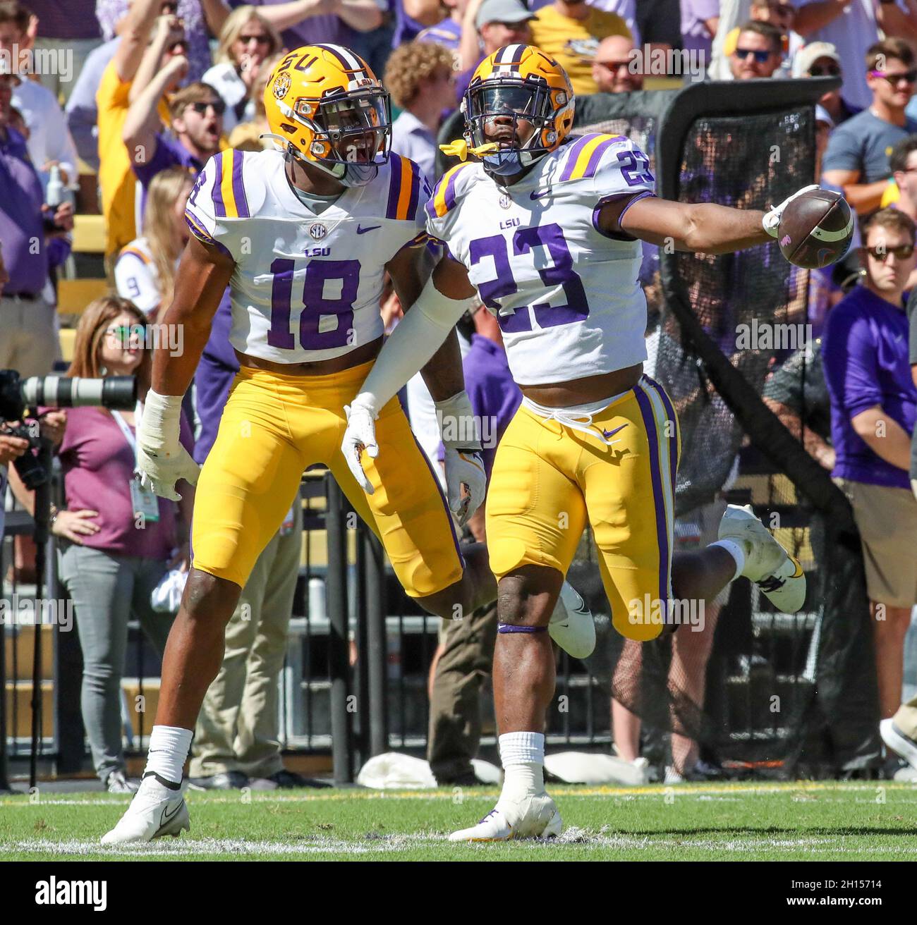 Baton Rouge, LA, USA. 16th Oct, 2021. LSU linebackers Micah Baskerville (23) and Damone Clark (18) celebrate an interception during NCAA football game action between the Florida Gators and the LSU Tigers at Tiger Stadium in Baton Rouge, LA. Jonathan Mailhes/CSM/Alamy Live News Stock Photo