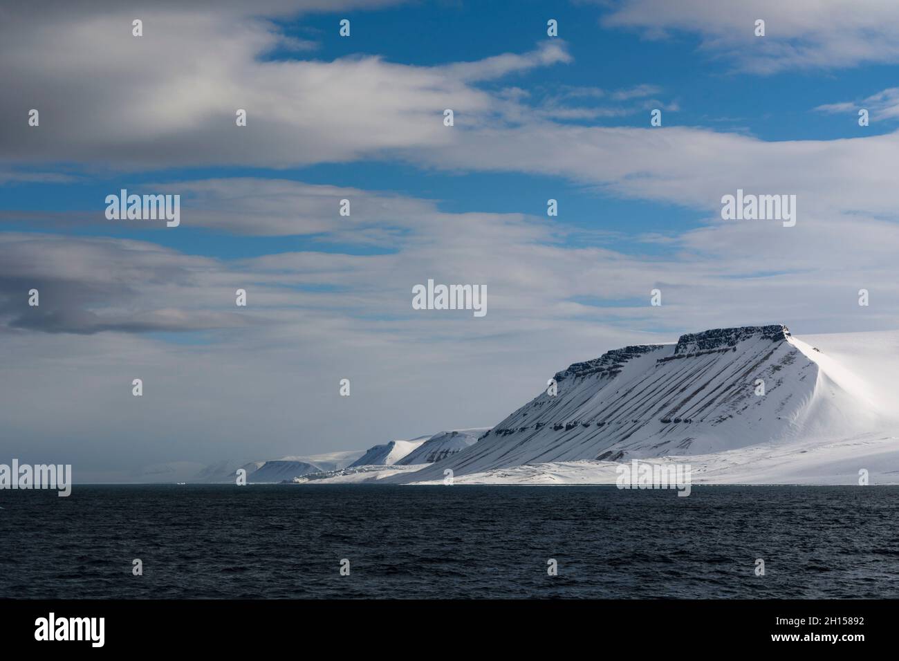 Snow-covered mountains in Hinlopen Strait. Nordaustlandet, Svalbard, Norway Stock Photo
