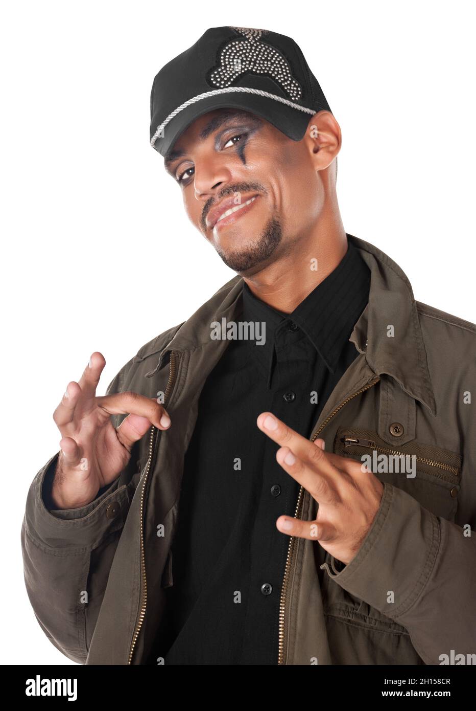 African musician singer with casual modern clothing and a cap wearing makeup, rock Stock Photo
