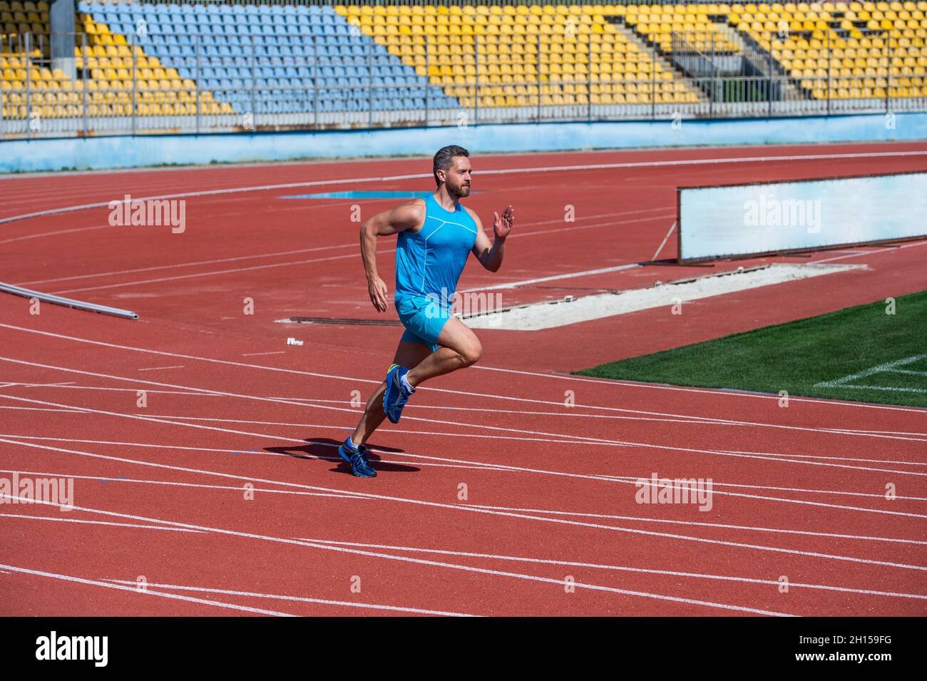 energetic and sporty. marathon speed energy. muscular man in motion. athletic man Stock Photo