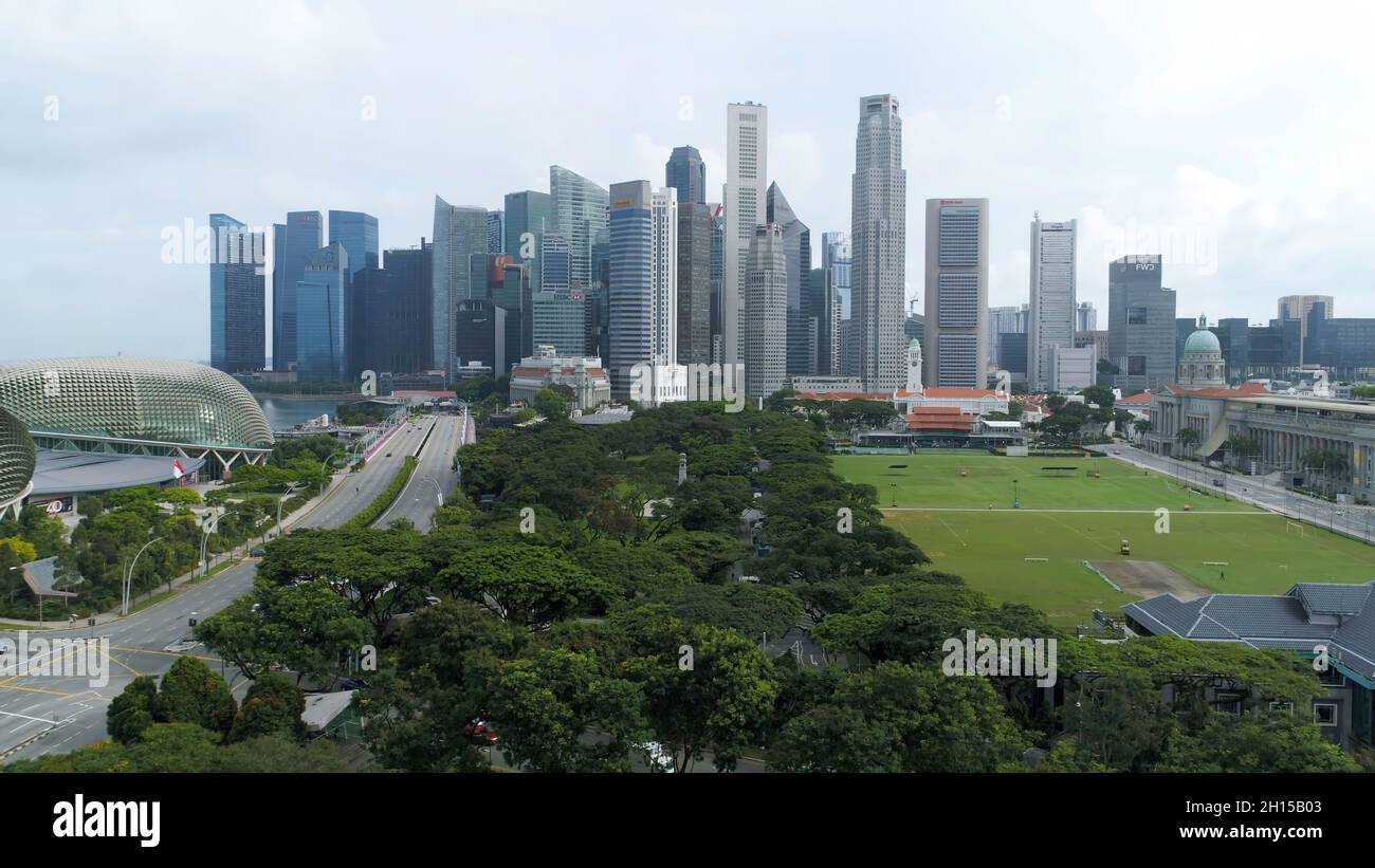 Aerial footage of Singapore skyscrapers with City Skyline during cloudy ...