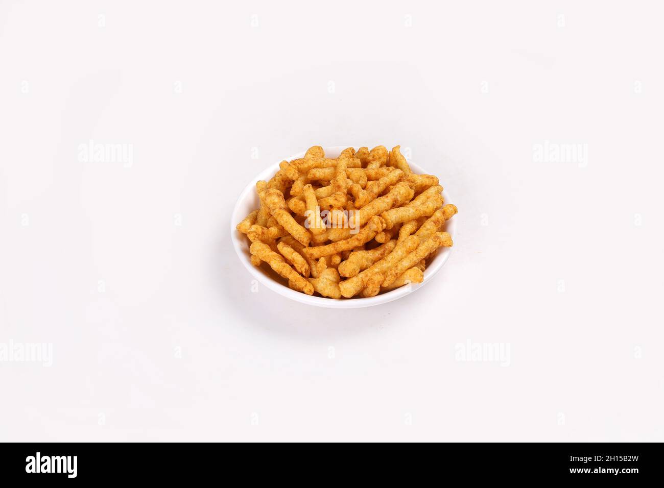 SNACKS STICKS CORN, isolated Image kurkure or namkeen sticks, background image. Stock Photo