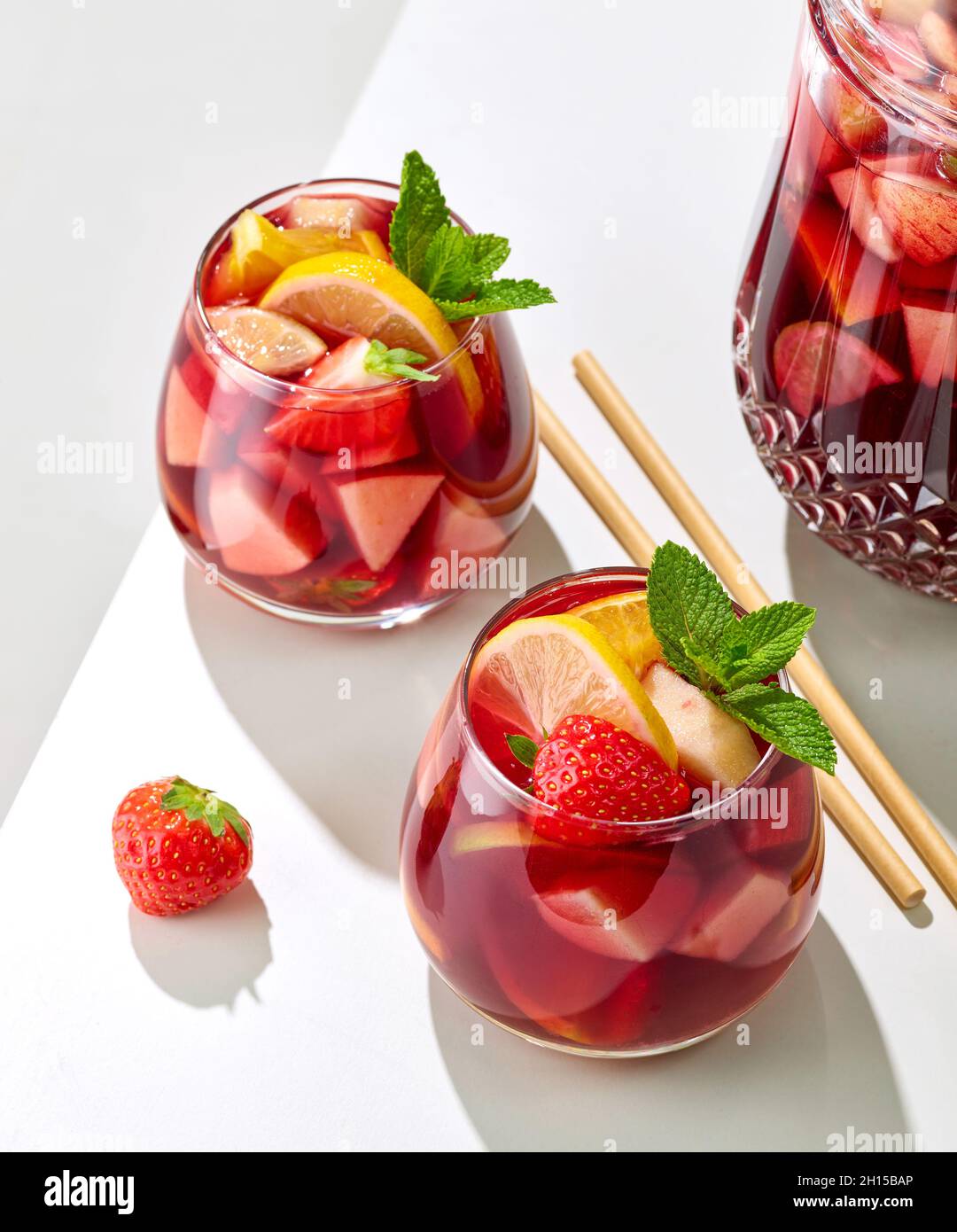 https://c8.alamy.com/comp/2H15BAP/jug-and-glasses-of-red-sangria-on-white-restaurant-table-2H15BAP.jpg