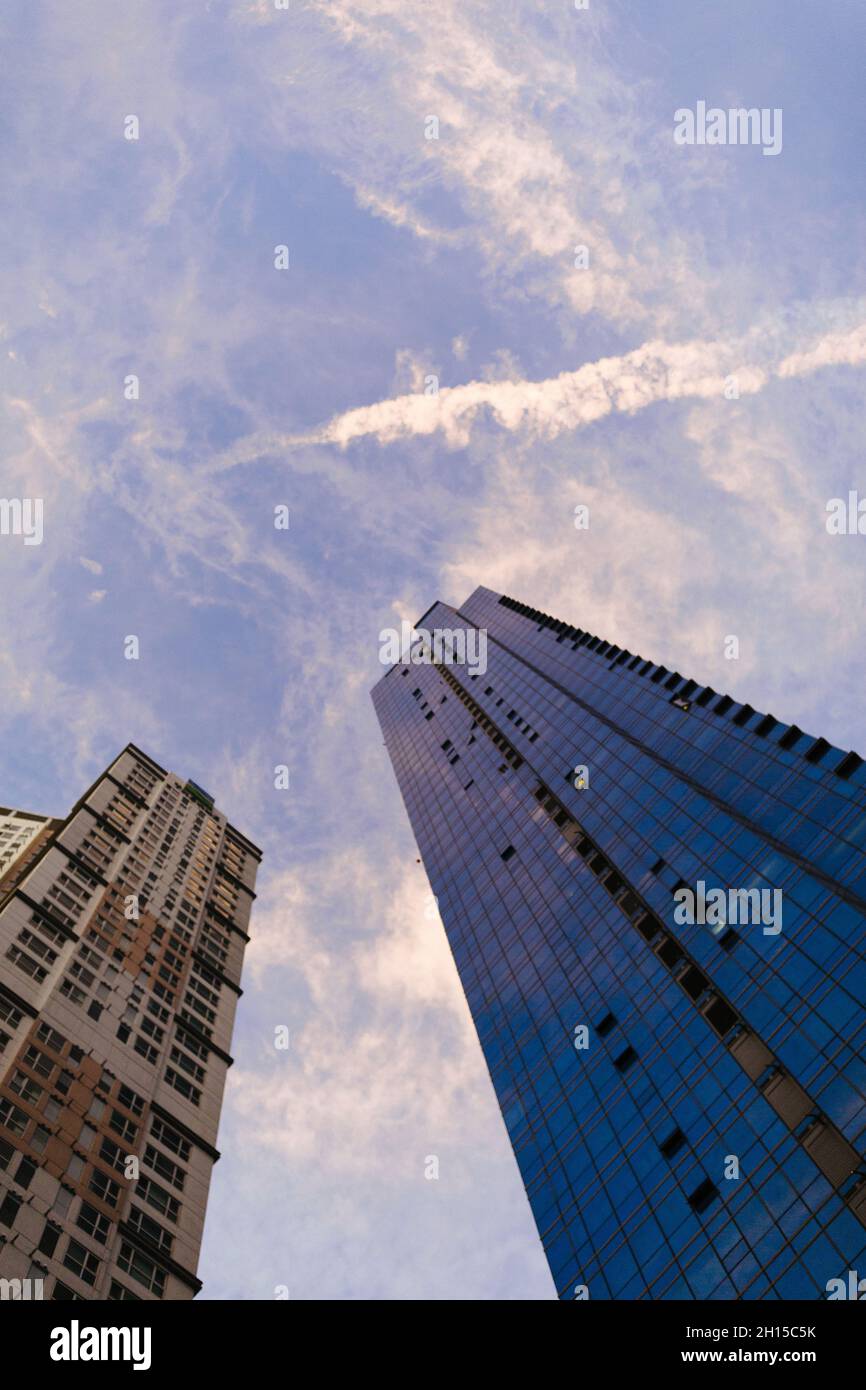 Low angle shot of modern high-rise buildings under the sunlight and a ...