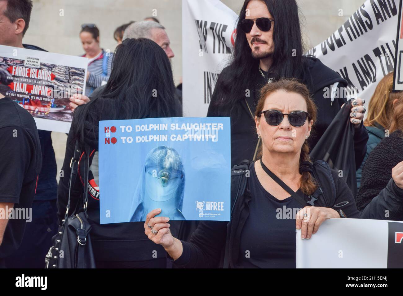 London, UK. 16th Oct, 2021. A protester holds a placard calling for an end to dolphin hunts and captivity during the demonstration in Trafalgar Square.Members of marine conservation organization Sea Shepherd and other activists marched through Westminster, calling for an end to the slaughter of dolphins in Faroe Islands and Taiji, Japan. (Photo by Vuk Valcic/SOPA Images/Sipa USA) Credit: Sipa USA/Alamy Live News Stock Photo