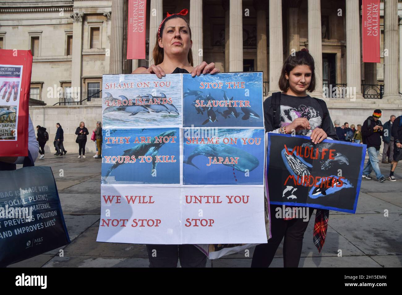 London, UK. 16th Oct, 2021. A protester holds a placard calling for an end to dolphin hunts during the demonstration in Trafalgar Square.Members of marine conservation organization Sea Shepherd and other activists marched through Westminster, calling for an end to the slaughter of dolphins in Faroe Islands and Taiji, Japan. (Photo by Vuk Valcic/SOPA Images/Sipa USA) Credit: Sipa USA/Alamy Live News Stock Photo