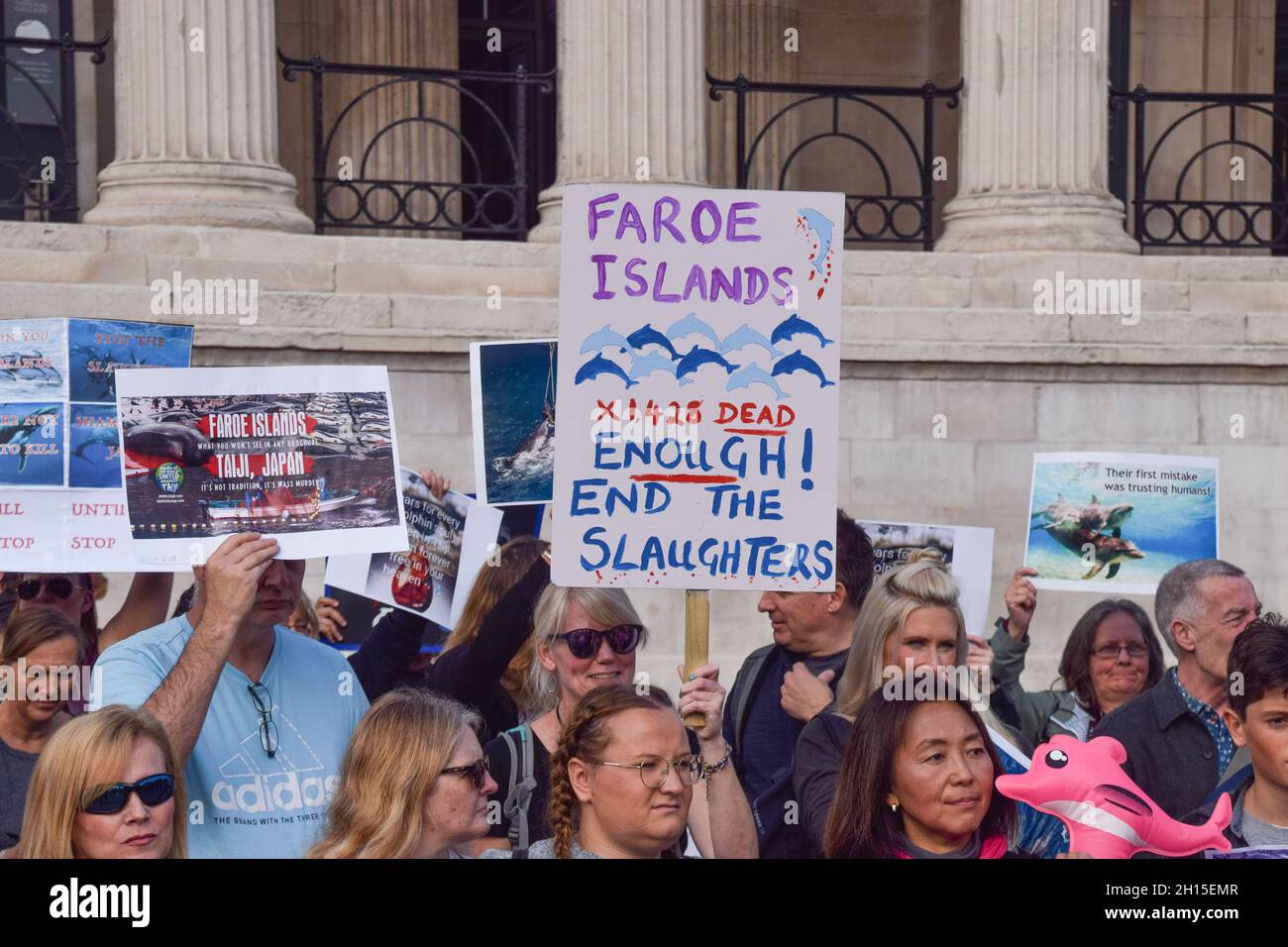 London, UK. 16th Oct, 2021. Protesters hold placards calling for an end to dolphin hunts during the demonstration in Trafalgar Square.Members of marine conservation organization Sea Shepherd and other activists marched through Westminster, calling for an end to the slaughter of dolphins in Faroe Islands and Taiji, Japan. Credit: SOPA Images Limited/Alamy Live News Stock Photo