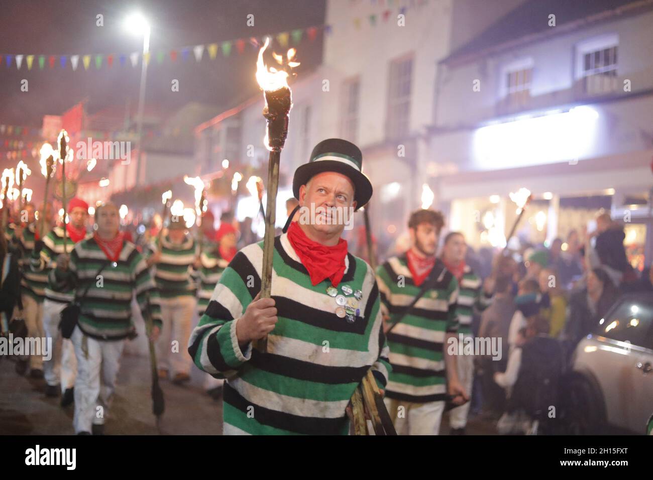 Hailsham, UK. 16th Oct 2021. Visiting bonfire societies parade in Hailsham this evening as Bonfire night returns to the town.  The event was cancelled in 2020 due to covid restrictions. Credit:Ed Brown/Alamy Live News Stock Photo