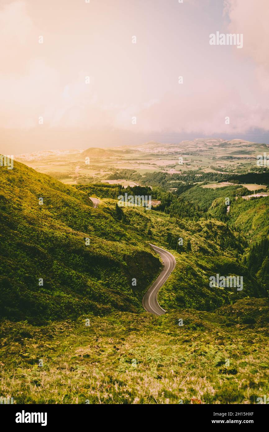 Endless mountain road with luxurious nature landscape in the Island of São Miguel. Azores Islands, Portugal. Stock Photo