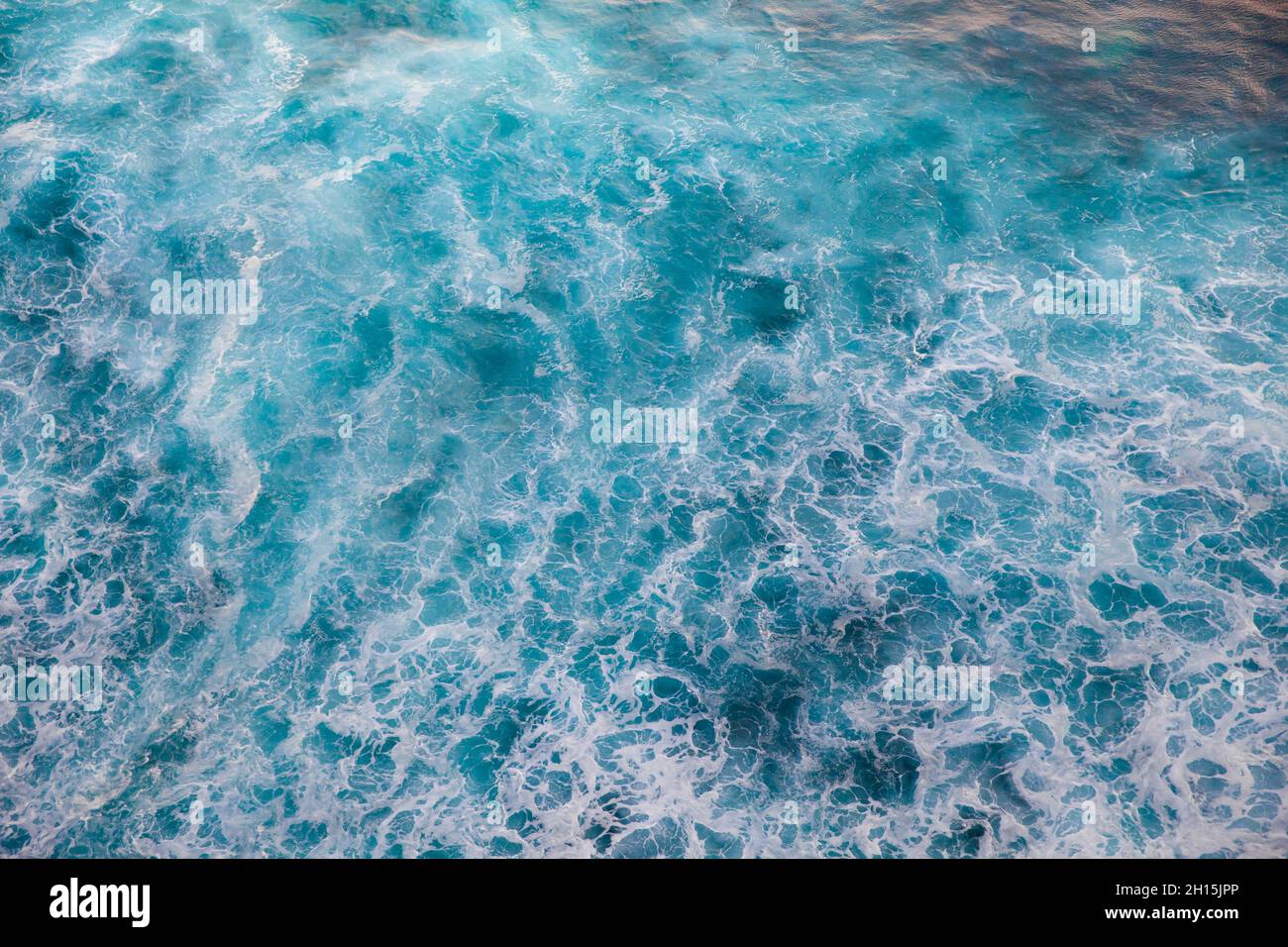 Deep blue stormy sea water surface with white foam and waves pattern ...