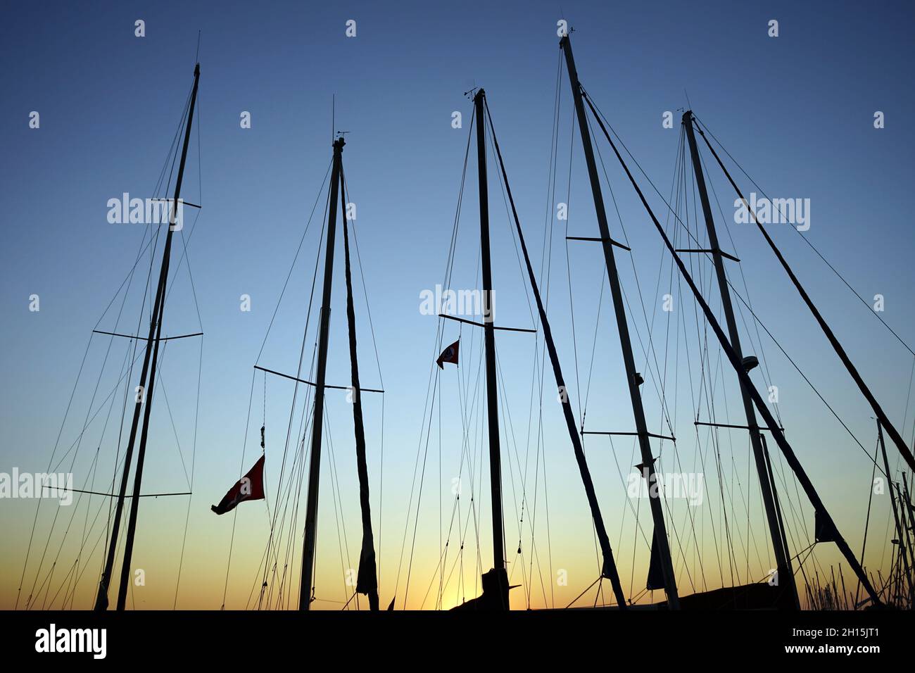 Silhouetted ship mast against the sunset sky Stock Photo - Alamy