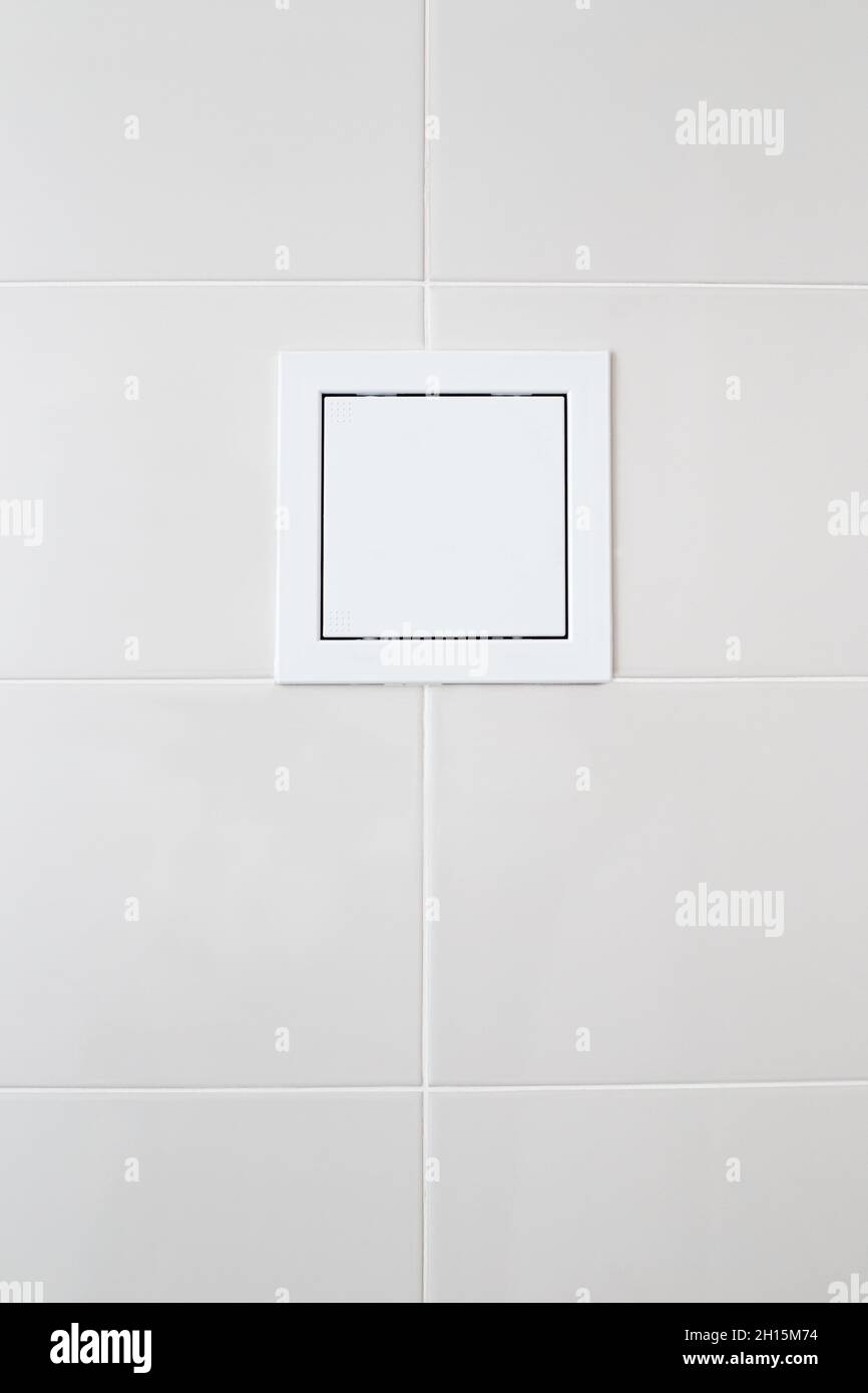 white plastic sunroof with water meters on white tiles on the bathroom wall Stock Photo Alamy