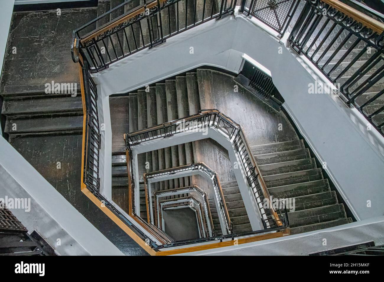 A downward perspective view of an old woodern staircase Stock Photo