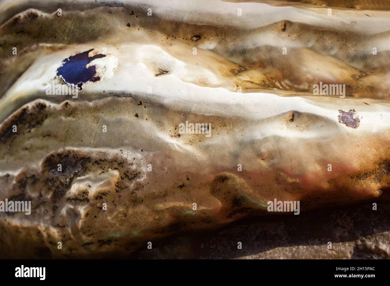 Close-up photo texture of copper or bronze statue material with folds ...