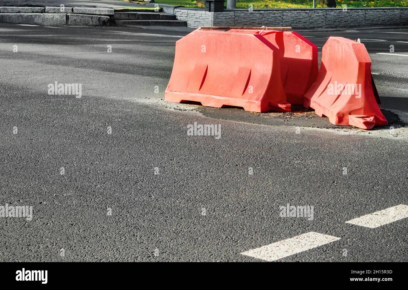 Photo of road construction plastic red colored barricades Stock Photo