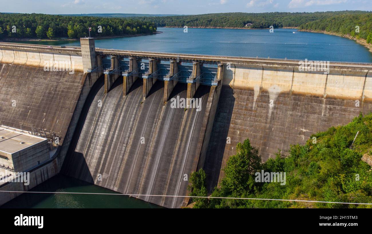 Greers Ferry Dam generating electricity on a sunny, summer afternoon in