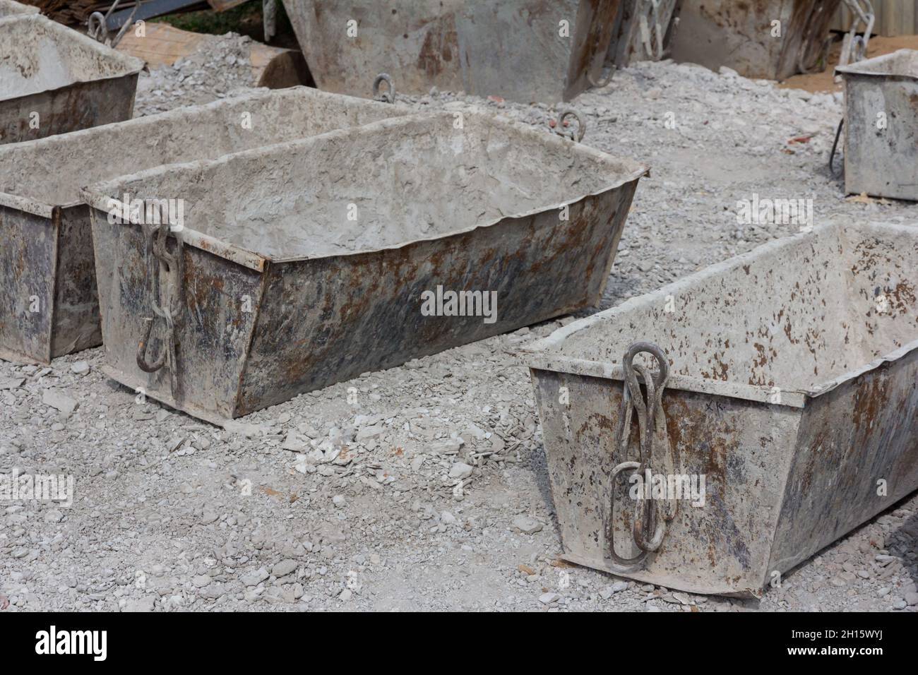 Empty cement mortar in construction tanks. Construction site. Construction equipment. Bricks Stock Photo