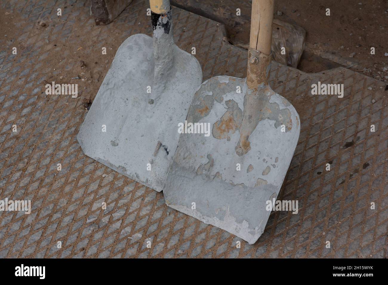 Close-up on two construction shovels. Construction tool. Stock Photo