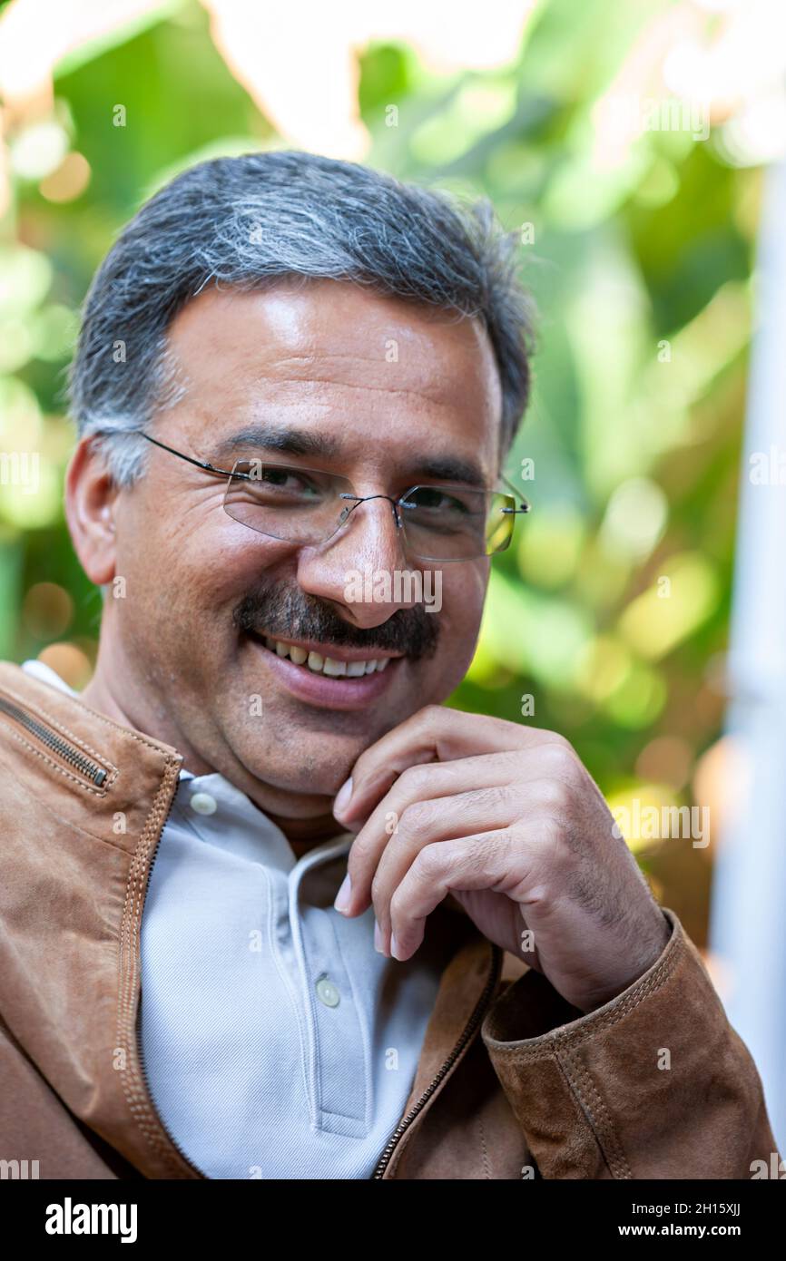 Portrait of an Iranian Arabic business man smiling Stock Photo