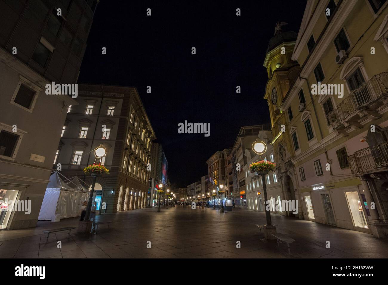 RIJEKA, CROATIA - JUNE 18, 2021: Selective blur on the empty  Korzo street at night in summer. Korzo is the main pedestrian street of Rijeka, on the a Stock Photo