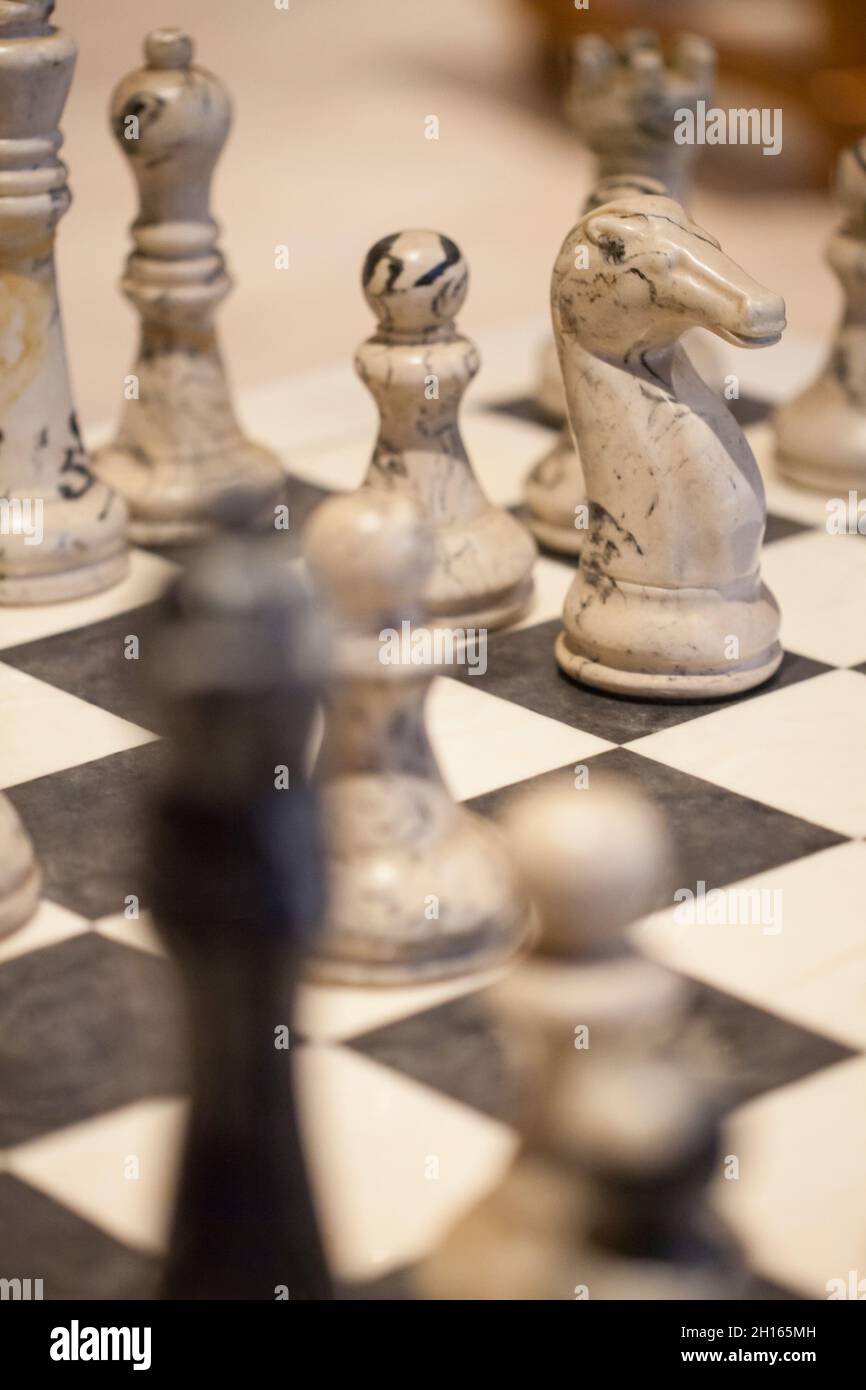 vintage lomo look of a chess table with marble chess pieces, Stock Photo