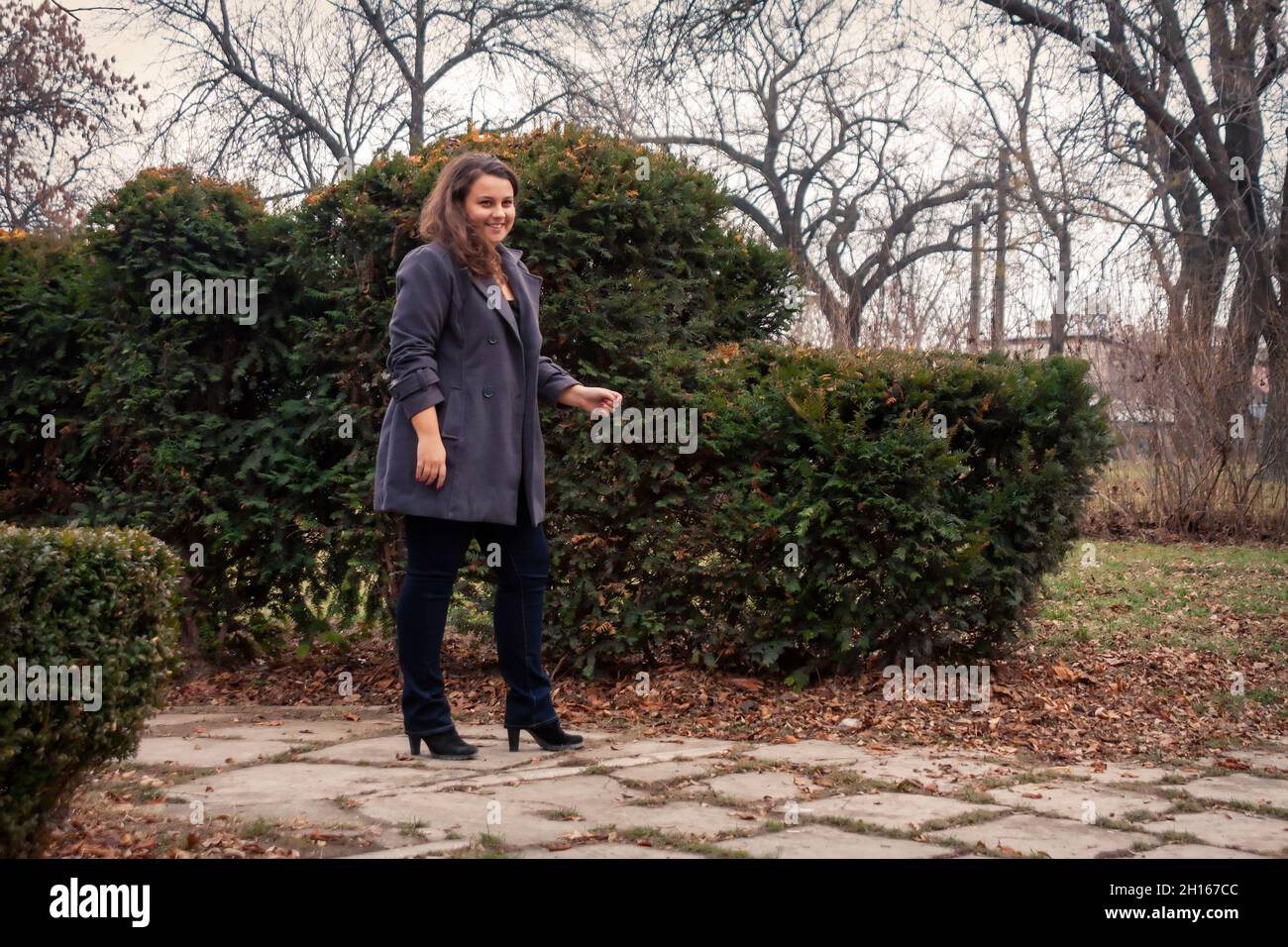 a young woman walking the park autumn season Stock Photo - Alamy