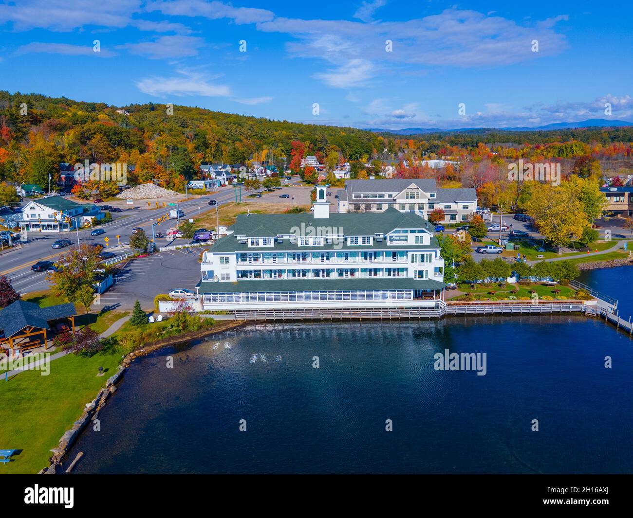 Bay point at Mill Falls with fall foliage aerial view with Meredith Bay