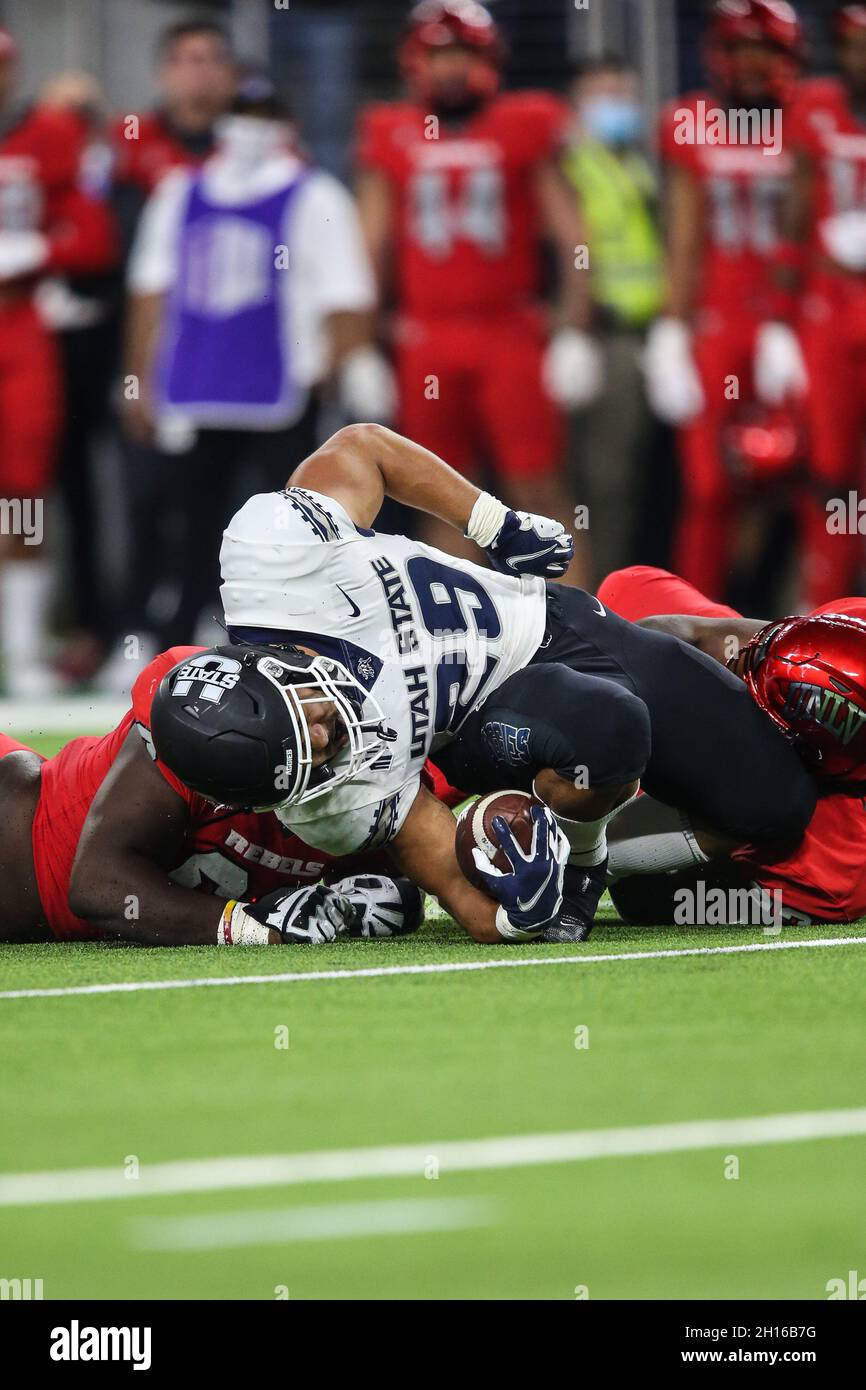 Las Vegas, NV, USA. 16th Oct, 2021. Utah State Aggies running back Pailate Makakona (29) is tackled during the NCAA football game featuring the Utah State Aggies and the UNLV Rebels at Allegiant Stadium in Las Vegas, NV. The Utah State Aggies defeated the UNLV Rebels 28 to 24. Christopher Trim/CSM/Alamy Live News Stock Photo