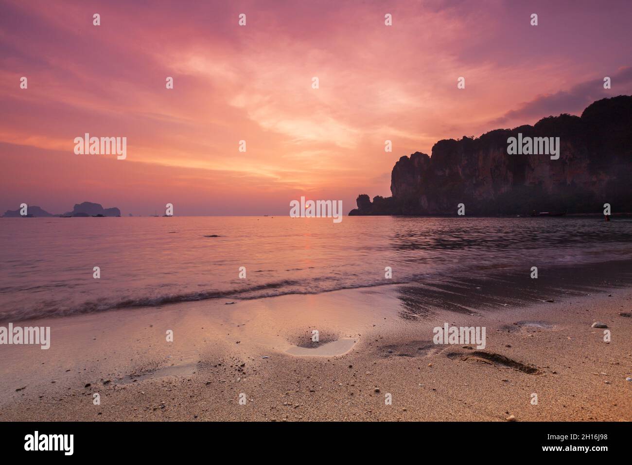 Beautiful beach in Thailand. Colorful sky in sunset. Reflection in ocean. Stock Photo