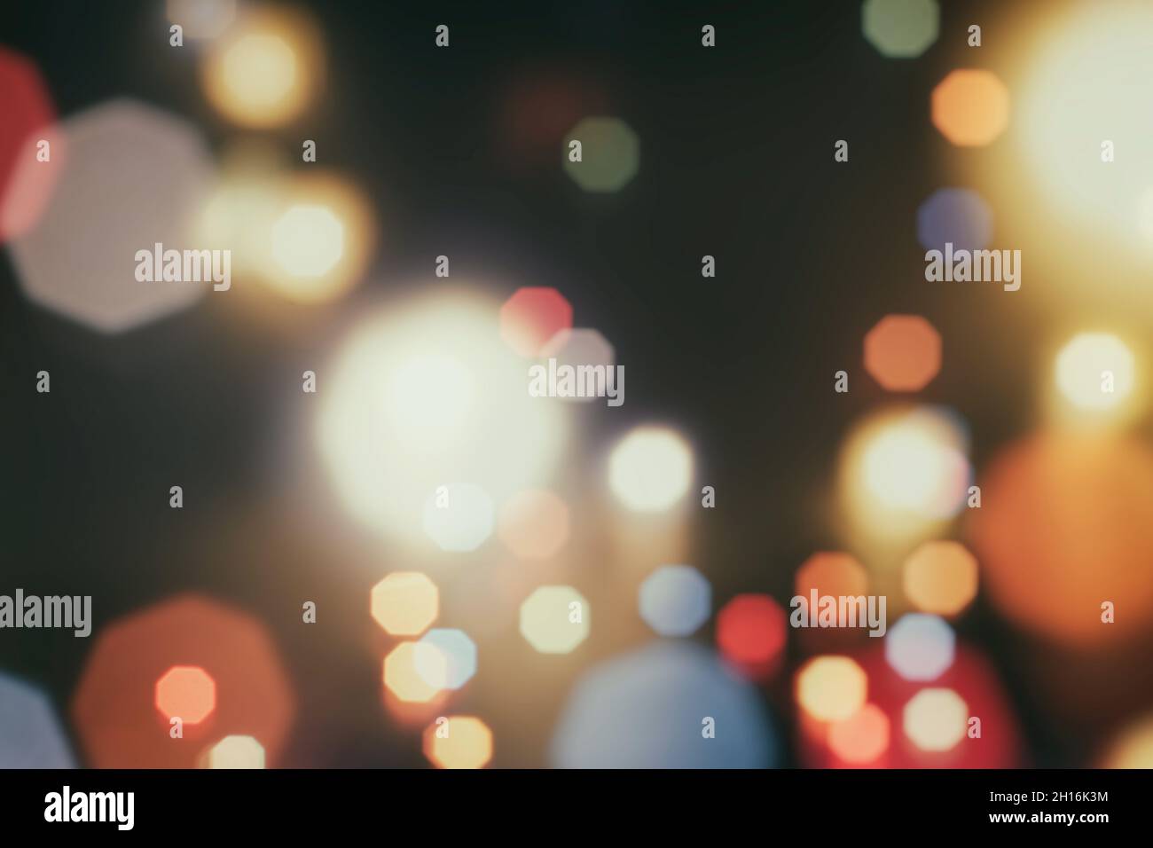 Abstract light celebration background with defocused golden lights for ...