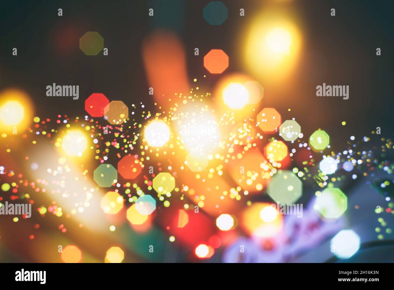 Abstract light celebration background with defocused golden lights for ...