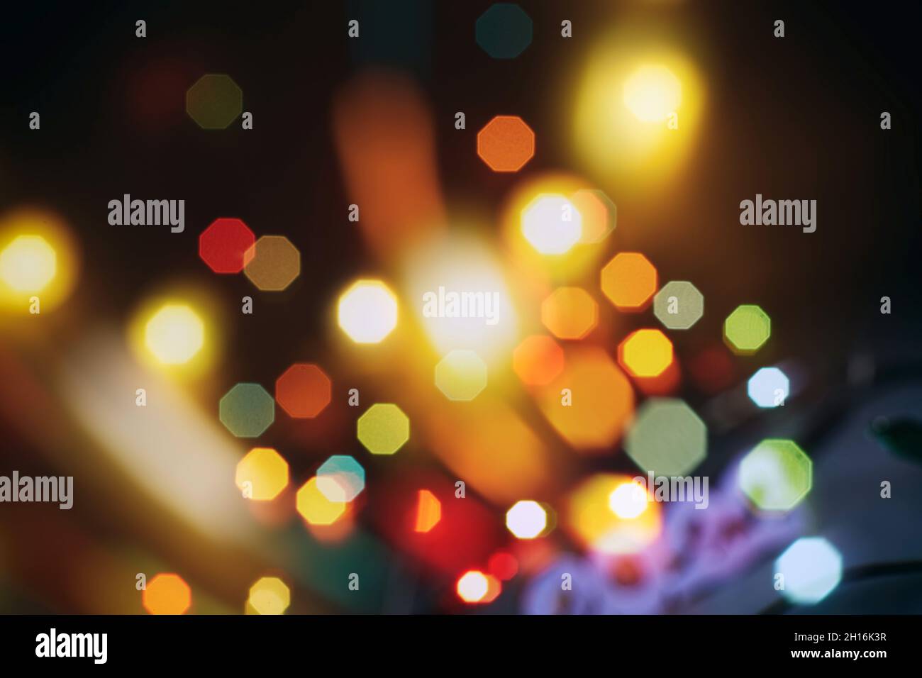 Abstract light celebration background with defocused golden lights for ...