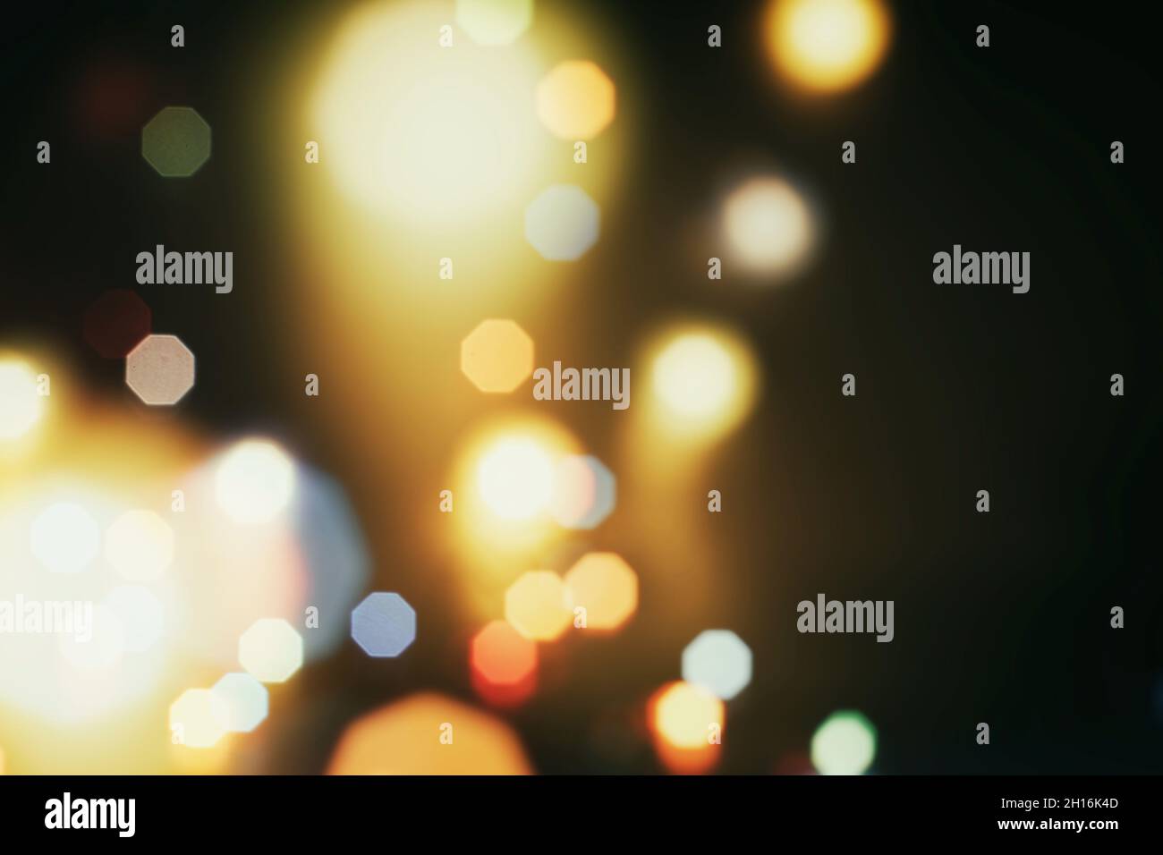 Abstract light celebration background with defocused golden lights for ...