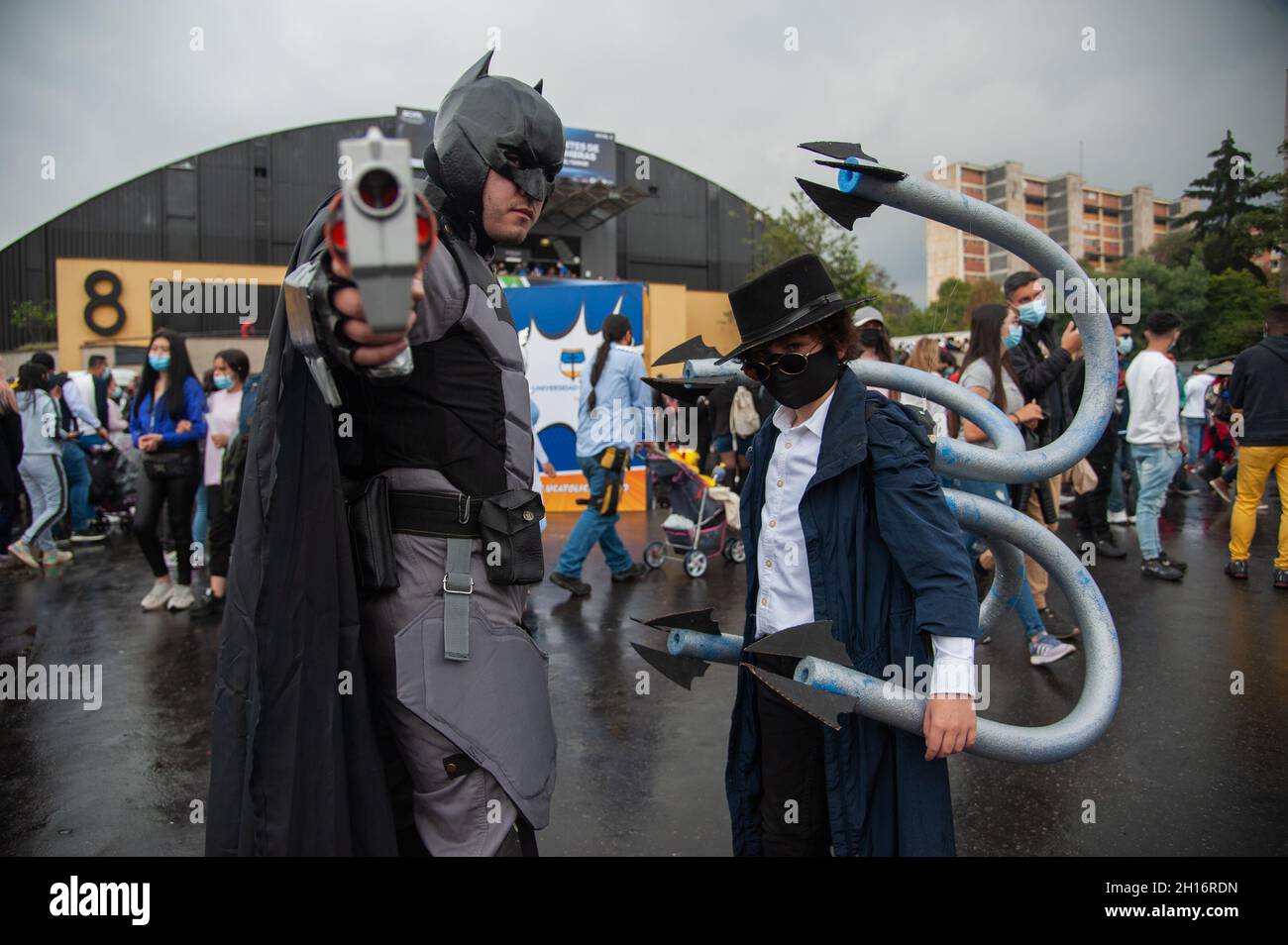 A father and his son cosplay DC character Batman (Left) and Marvel's  Spiderman enemy Doctor Octopus (Right) during the first day of the SOFA  (Salon del Ocio y la Fantasia) 2021, a