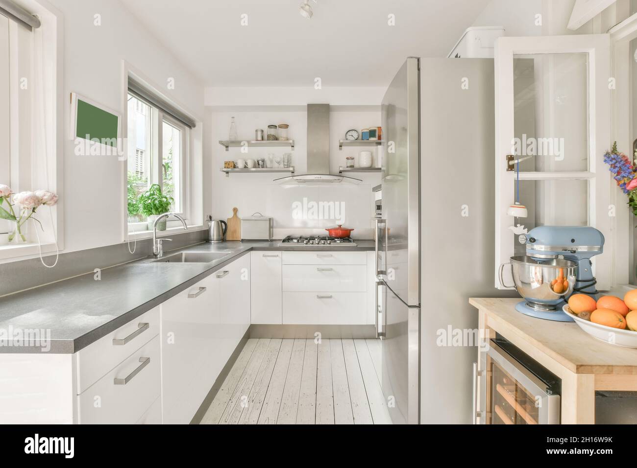 Stylish minimalist design of kitchen interior with white walls and ...