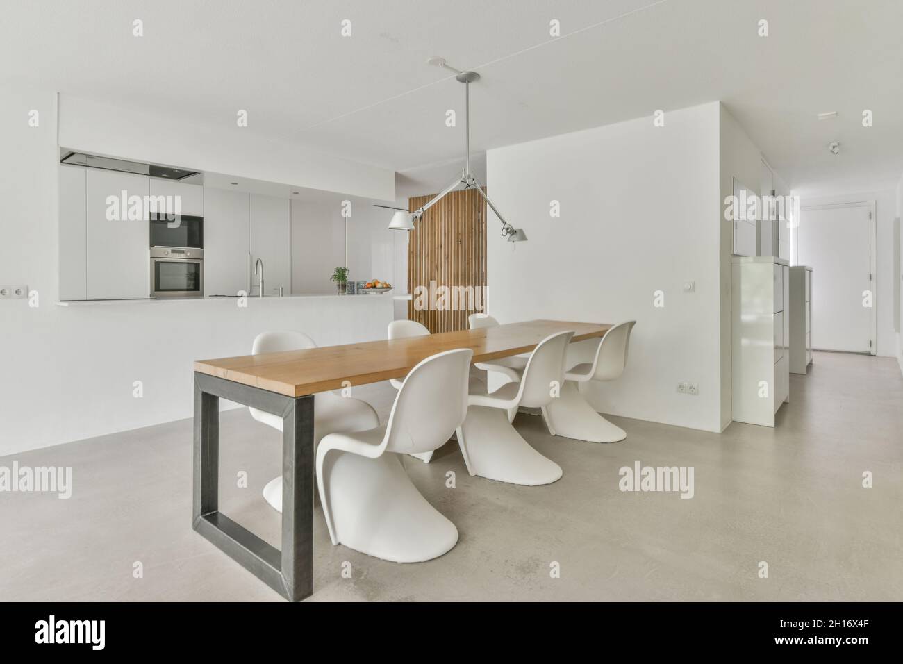 Contemporary dining room and kitchen interior with built in electric ...