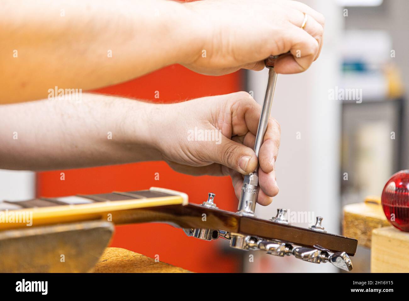 Crop unrecognizable craftsman using tubular socket wrench while