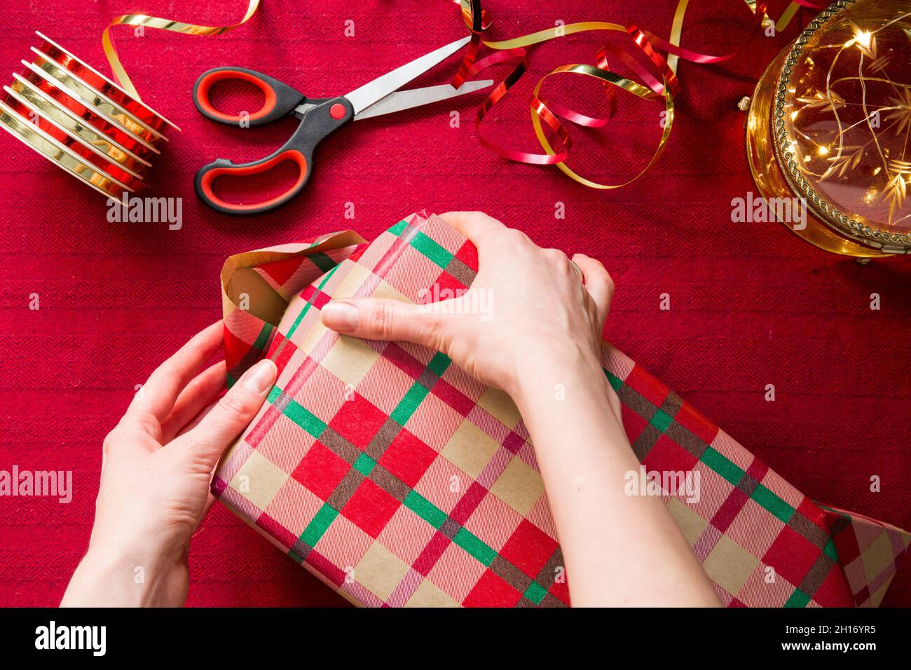 Rolls of colorful wrapping paper, scissors and ribbons on white background,  top view Stock Photo - Alamy