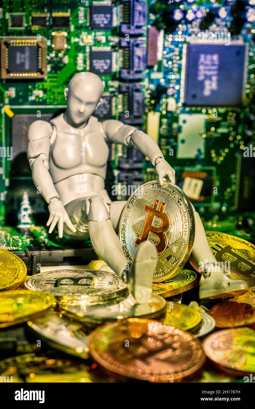 conceptual bitcoin, miner with computer boards and a treasure of Bitcoin Stock Photo