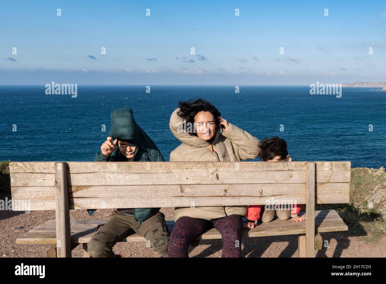 family sitting on the best bench in the world Stock Photo Alamy