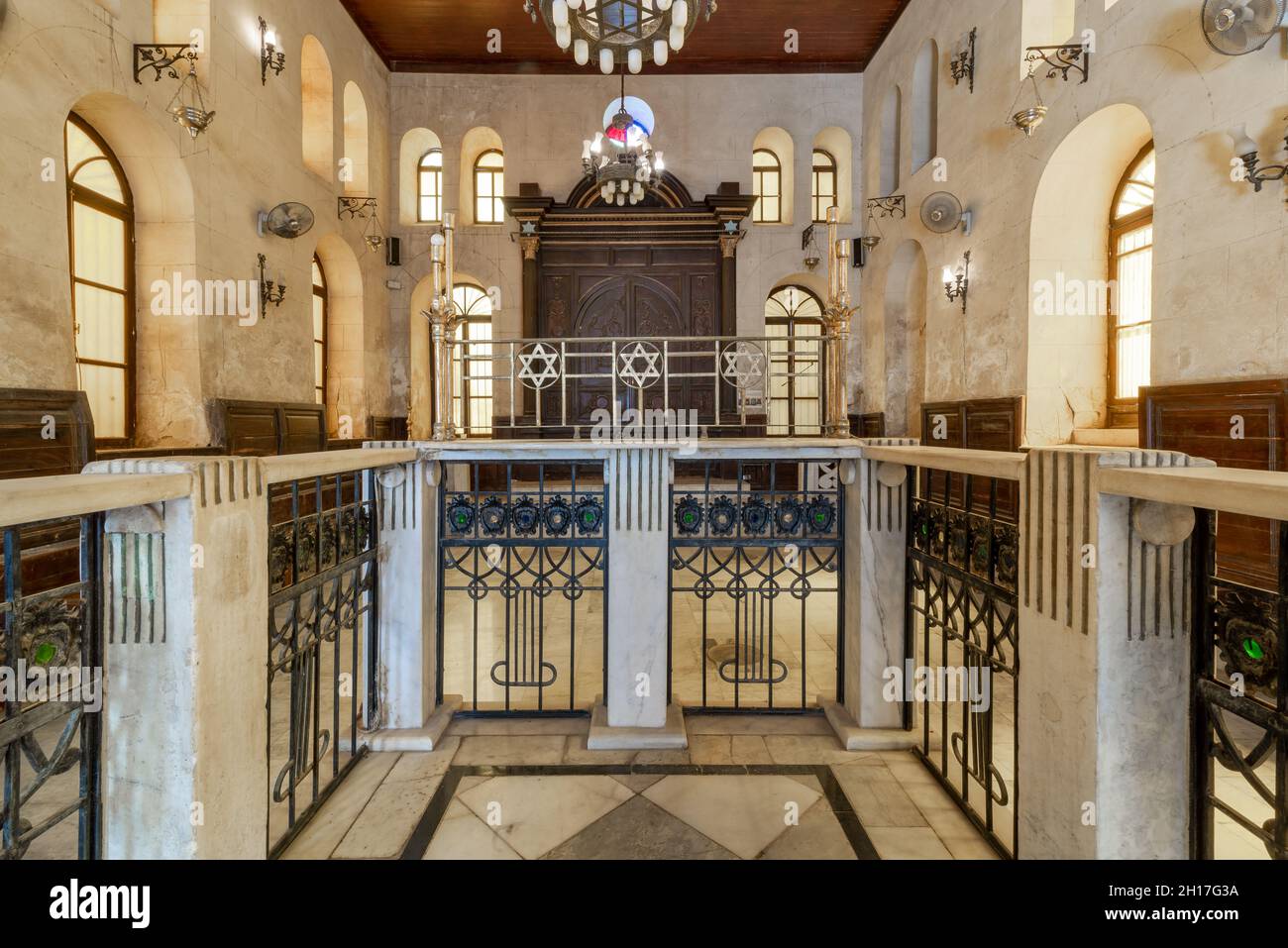Altar of historic Jewish Maimonides Synagogue or Rav Moshe Synagogue with wooden entrance at the far end, Gamalia district, Cairo, Egypt Stock Photo