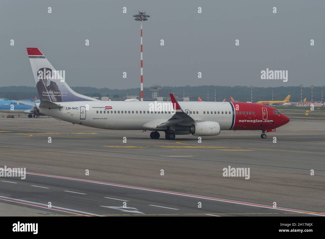 MILAN, ITALY - SEPTEMBER 29, 2017: Norwegian Air Shuttle Boeing 737-8JP (LN-NIC) with a portrait of Fredrikke Marie Qwam on the airfield of Malpensa a Stock Photo