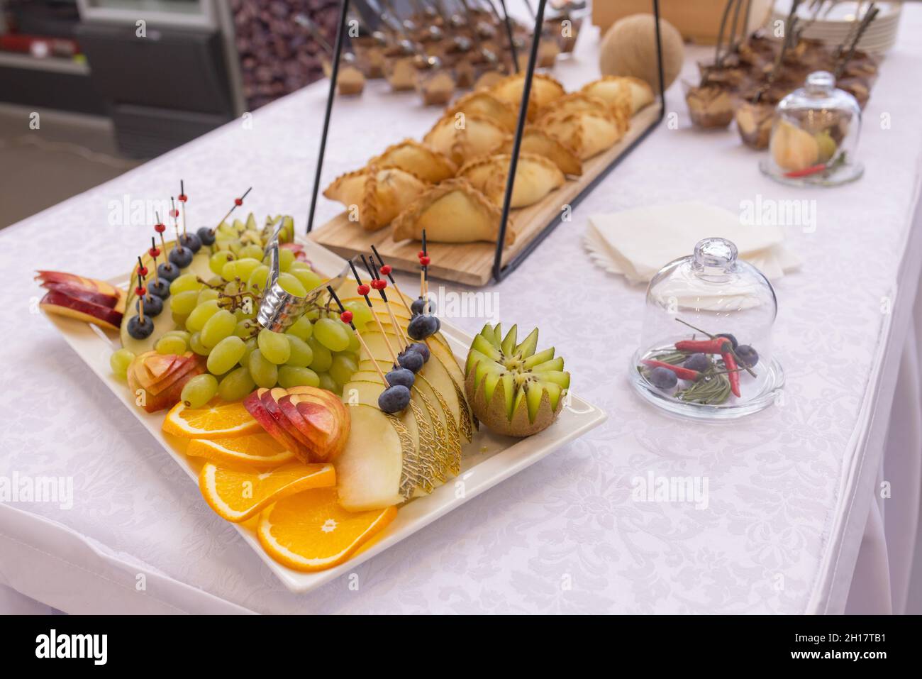 Different types of canapes on buffet table Stock Photo