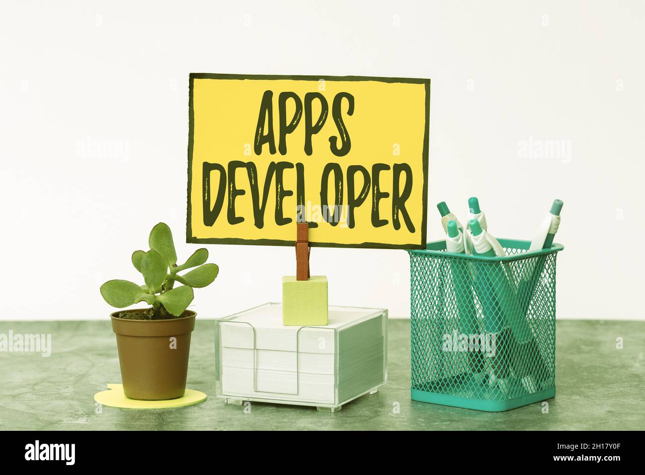 Handwriting text Apps Developer. Word Written on Graphic artist Software Programmer and Analyst Experts Tidy Workspace Setup Writing Desk Tools And Stock Photo