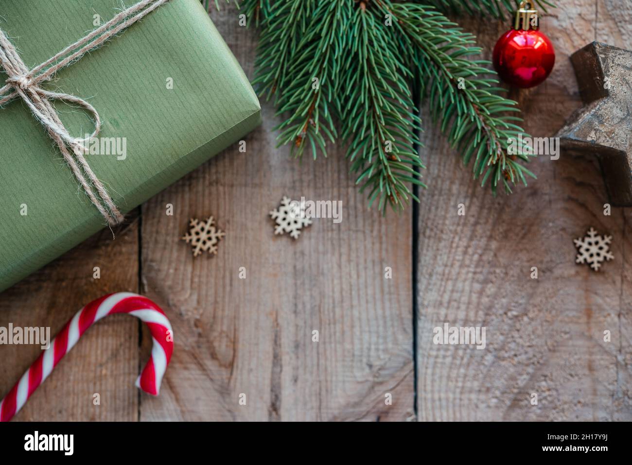 Christmas composition with gift boxes, candy canes, and pine tree ...