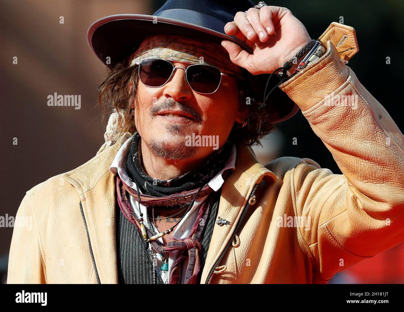 Actor Johnny Depp gestures at the red carpet ahead of a screening of the  animated web series 'Puffins' at the 16th Rome Film Fest, in Rome, Italy,  October 17, 2021. REUTERS/Yara Nardi