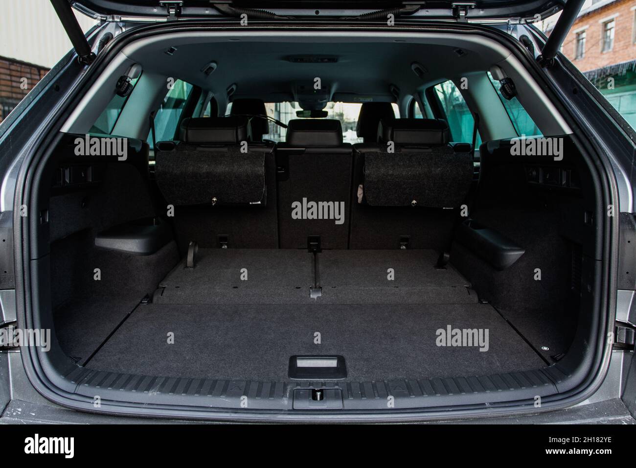 Huge, clean and empty car trunk in interior of a modern compact suv