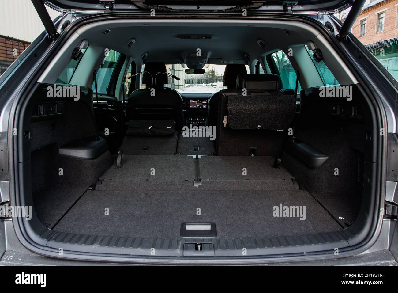 Huge, clean and empty car trunk in interior of a modern compact suv