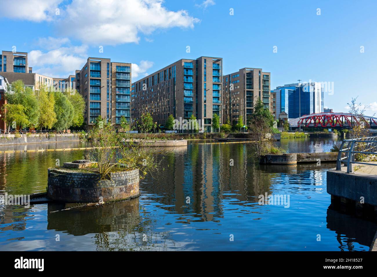 The Clippers Quay apartment blocks and the Exchange Quay office buildings over the Manchester Ship Canal, Salford, Manchester, England, UK Stock Photo