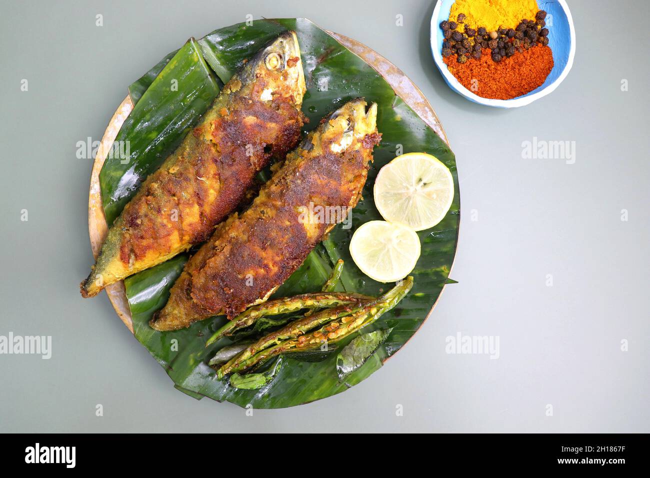 Indian Mackerel fish fry. Bangda Rava fry. whole Fried fish served on a ...